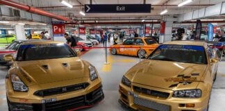 A skyline of legends: GT-Rs, Supras, and widebody supercars lined up in a display of pure power. TOP Secret