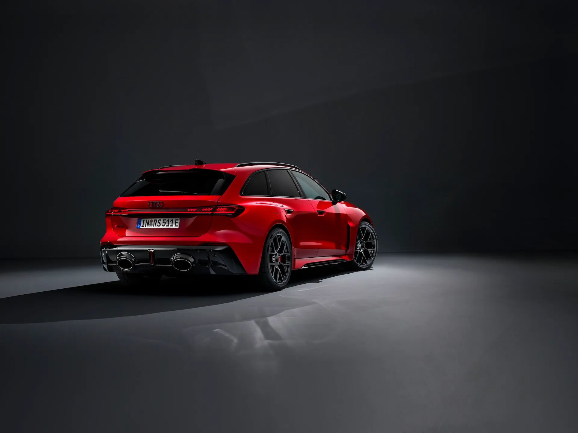 2027 Audi RS5 Avant rear three quarter studio shot with black wheels
