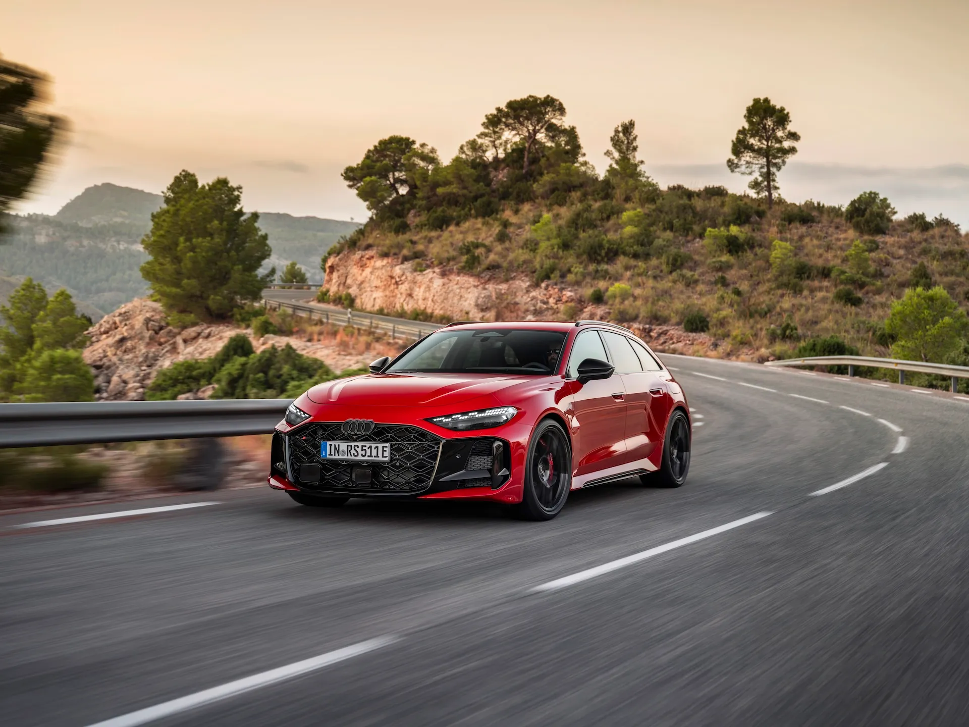 2027 Audi RS5 Avant front three quarter view on winding canyon road