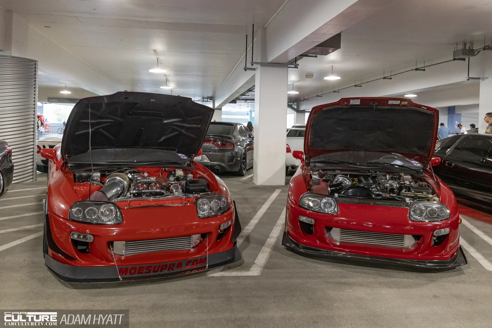 pair of red A80 Toyota Supras