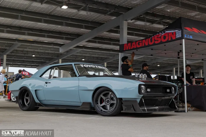 Modified 1967 Camaro widebody on Gram Lights wheels at Magnuson Superchargers booth Long Beach